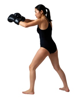 A woman in a black bodysuit is practicing boxing photo