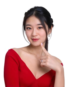 A woman in a red dress is pointing her finger photo