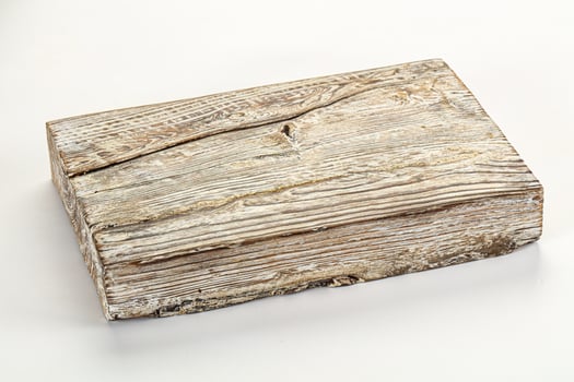 A wooden box sitting on a white surface photo