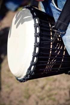 A person holding a drum photo