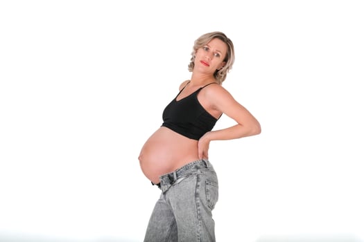 A pregnant woman in jeans and a black top photo