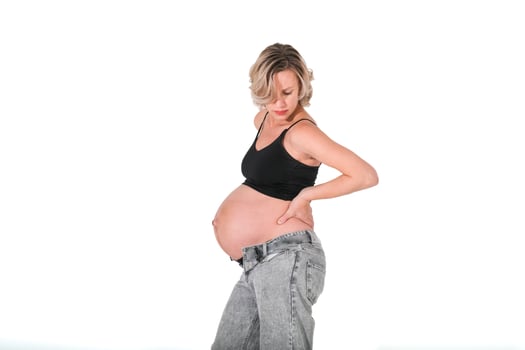 A pregnant woman in jeans and a black top photo