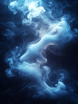 Blue smoke creating abstract shapes on black photo