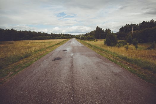 A long empty road in the middle of nowhere photo