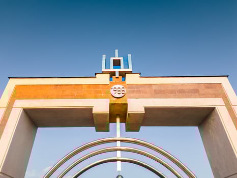 Simonas Daukantas bridge Metal artwork and Kaunas old town panorama. Suspension type pedestrian bridge connects Simonas Daukantas street with Nemunas island photo