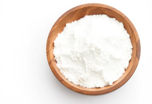 a wooden bowl filled with white powder photo