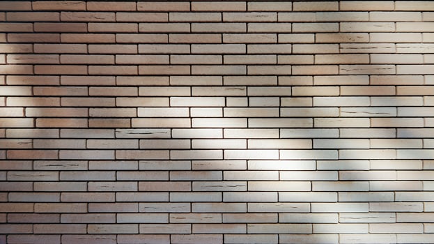 Beige Brick Wall with Subtle Shadow Patterns and Textured Design in Natural Lighting photo