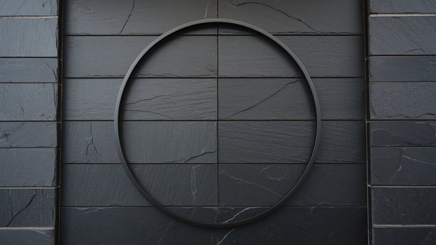 Minimalist Black Metal Circle Frame on Dark Textured Slate Tile Wall for Modern Design Concepts photo