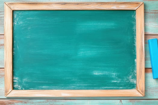 Olive-green chalkboard with warm wood trim and vibrant blue chalk ready for lessons and notes photo