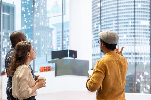 Business clients discussing design and layout of a new office space with the broker, reviewing a high class building and planning a real estate investment strategy for development. photo