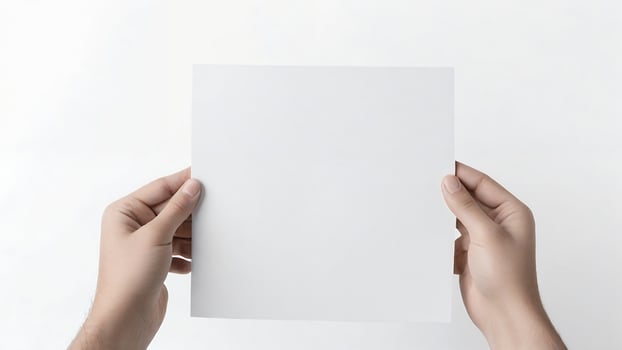 Hands holding blank white paper. photo