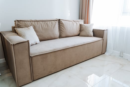 Furniture Brown rectangle couch on hardwood floor near window in living room photo