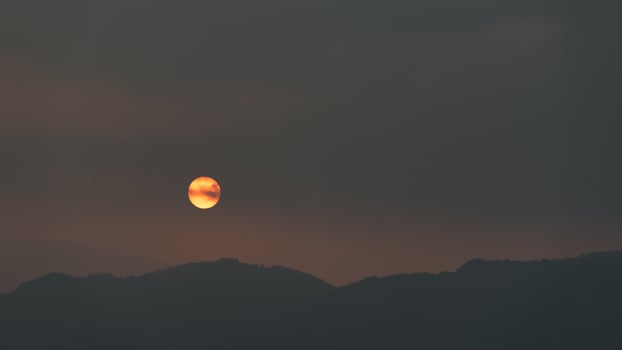 Abstract landscape of mountains with setting sun photo