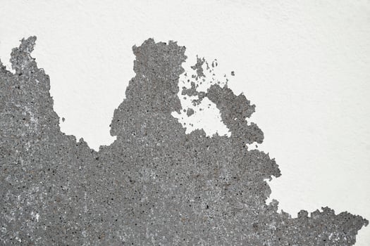 Old paint peeling off on concrete wall photo