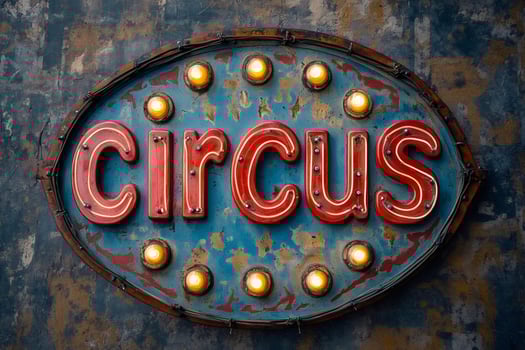 Vintage circus sign hanging on a textured wall, illuminated by light bulbs photo