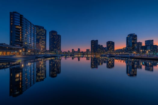 Melbourne docklands reflecting in water at dusk with colorful sky photo