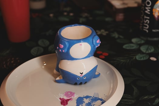 HandPainted Adorable Cute Ceramics Showcasing an EyeCatching Vibrant Blue Whale Design photo