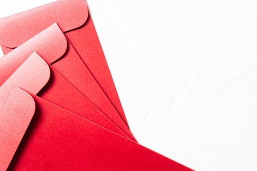 Collection of Glossy Red Envelopes on White Background photo