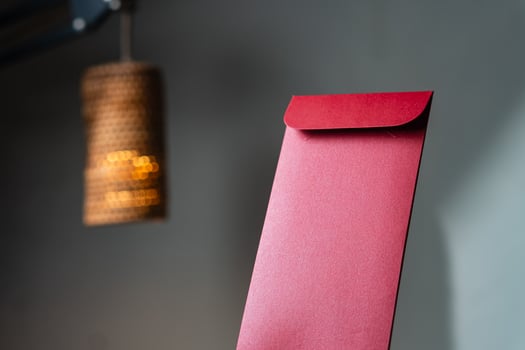 Elegant Red Envelope with Warm Lamp Background photo