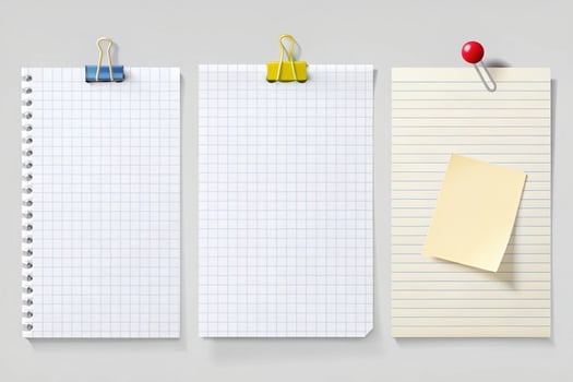 Set of blank white and lined paper sheets with binder clips, push pins, and sticky notes, perfect for office, school, or design use photo