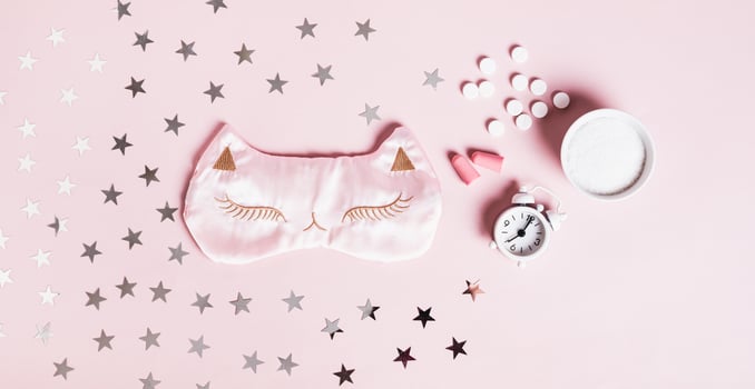 Concept good sleep, magnesium powder, sleep mask, alarm clock and earplugs on pink web banner photo