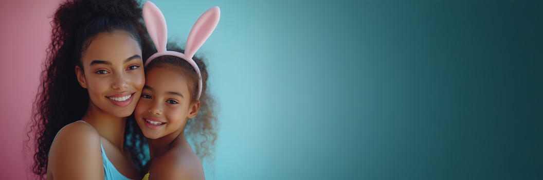 Mother and daughter embrace in playful moment with bunny ears during springtime celebration photo