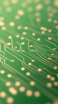 Extreme Close Up of Green Printed Circuit Board with Electronic Lines Focusing on Chip Connections and Components in High Detail for Technology and Engineering Concepts photo
