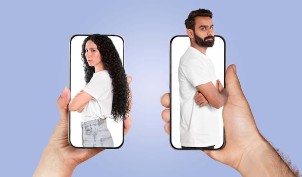 A couple engaged in a digital interaction, holding smartphones featuring their images. They smile as they communicate, reflecting modern love in a connected world. photo