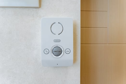 The digital climate control panel on the light wall interior offers precise adjustment for temperature and ensures a comfortable indoor environment with modern smart technology photo