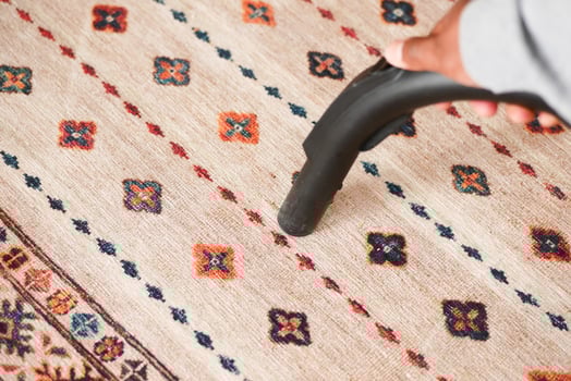 cleaning a carpet with vacuum a cleaner, photo