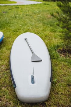 Enjoy the excitement of Stand Up Paddleboarding in the great outdoors, surrounded by natures beauty. Discover peaceful waterways, blending adventure with serenity photo