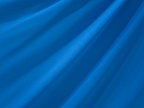 Texture background template. Silk color light blue background is a shiny light blue wave photo