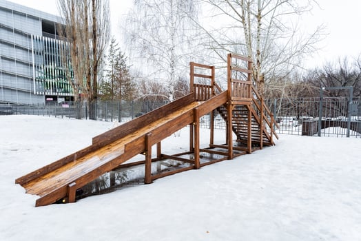 A wooden slide in the snow photo