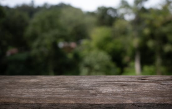 a wooden table top with a blurry background photo