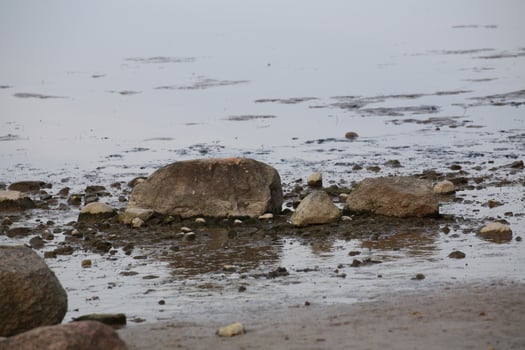 Stones lying in reflecting water. photo