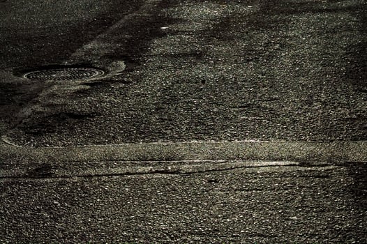 Sunlight reflections on wet asphalt. photo
