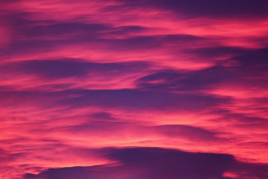 Impressive pink and purple cloudscape in the evening photo