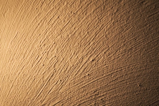 Brush marks on an illuminated white wall photo