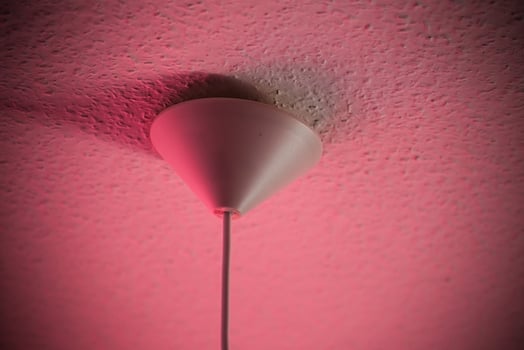 Conceptual shot of lamp part at the ceiling. photo