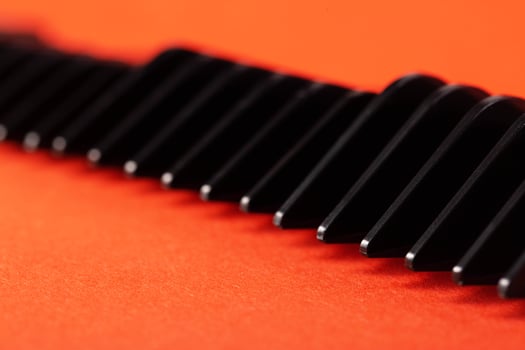 Set of edging attachments for trimmer on a red background, close-up. Copy space for text photo