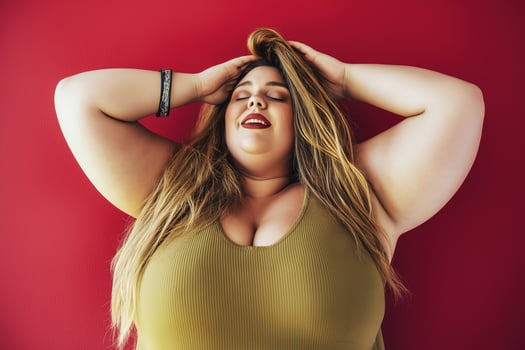 Portrait of a joyful drag queen laughing against a vibrant red background in a colorful and lively atmosphere photo