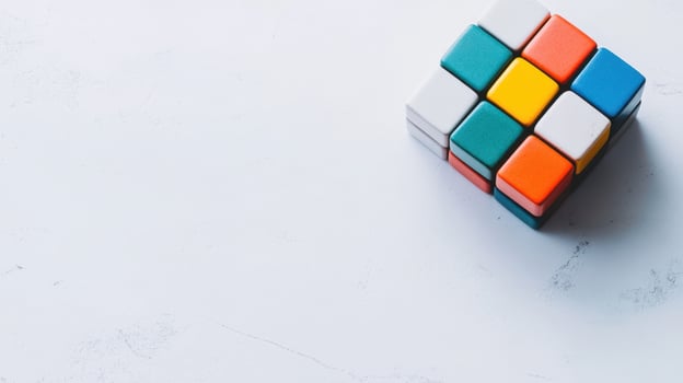 Colorful Rubik's Cube rests on a white surface, inviting puzzle enthusiasts to solve its complexities in a relaxing environment photo