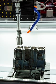 Setting up precision machining processes for the fabrication of automotive engine blocks is crucial for manufacturing efficiency and quality control photo