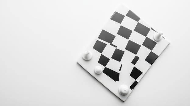 Creative black and white checkerboard art piece displayed on a minimalistic surface photo