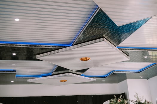 A contemporary ceiling featuring geometric panels, integrated lighting, and a sleek so nice photo