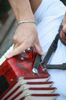 Closing An Accordion At The End Of A Performance photo