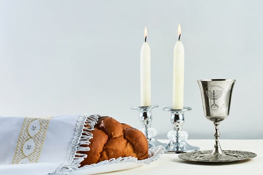 Sabbath Table Setting. Elegant Sabbath table with braided bread, candles, and wine cup. photo