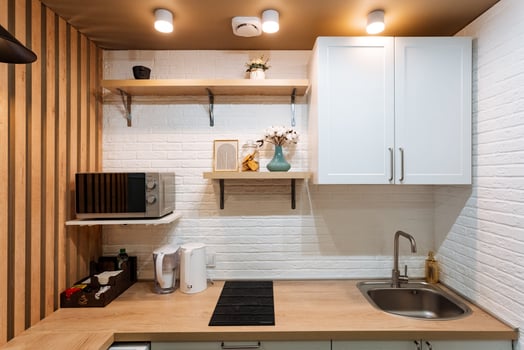 A beautifully designed contemporary kitchen showcases elegant wooden accents along with sleek and modern appliances, enhancing utility and style photo
