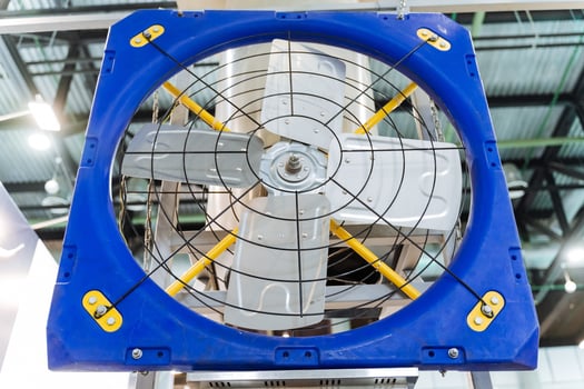 A blue and yellow fan with a yellow center photo