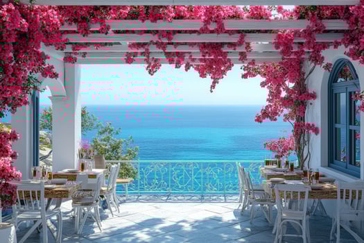 Bougainvillea blooming over cozy mediterranean restaurant terrace overlooking turquoise sea photo